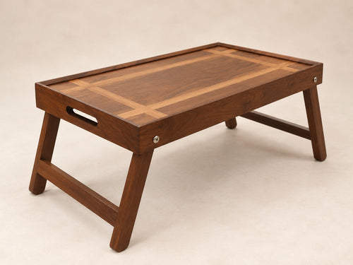 The Butler foldable wooden tray table for breakfast and laptop use by Utilihaus